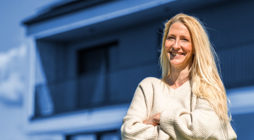 woman smiling for picture with arms crossed