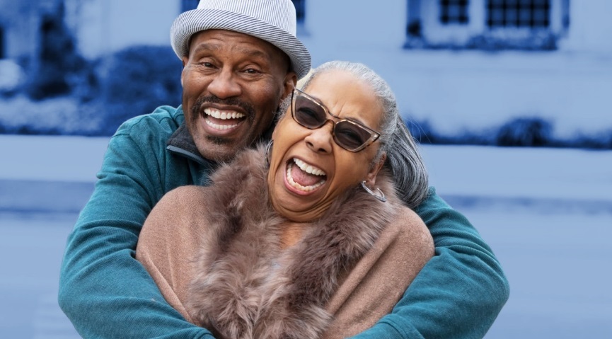 man and woman smiling and laughing